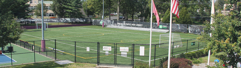 a sports field with flags